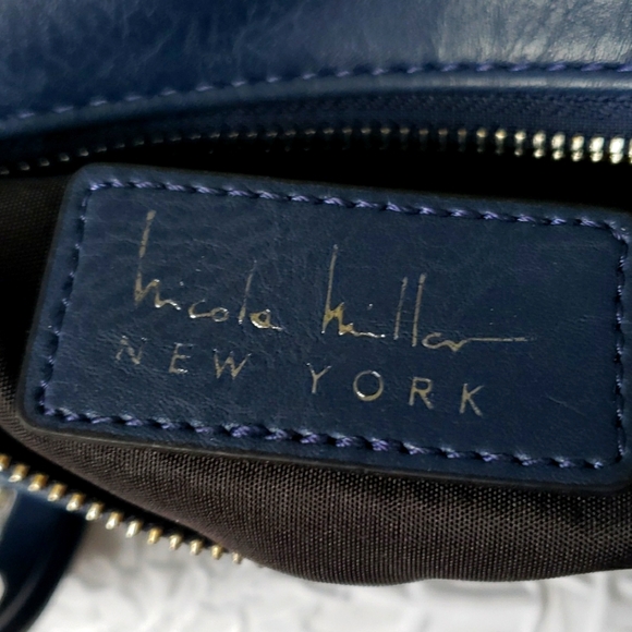 Nicole Miller Navy Faux Leather Crossbody Bag with adjustable strap. 11" x 8" - Picture 9 of 16